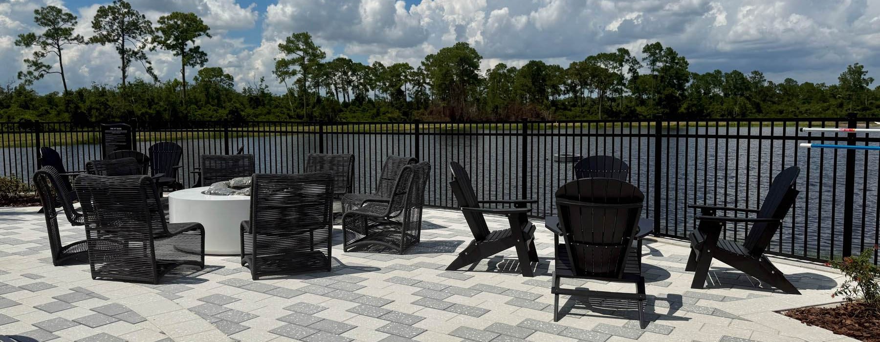 a fire pit area with chairs